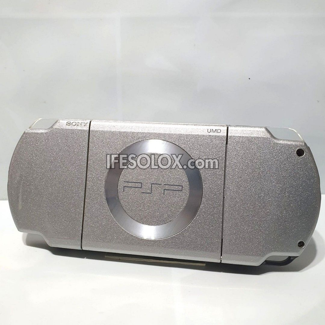 PlayStation Portable PSP 2000 series Slim Game Console with 16GB Memory Stick and 15 Games (Silver) - Foreign Used