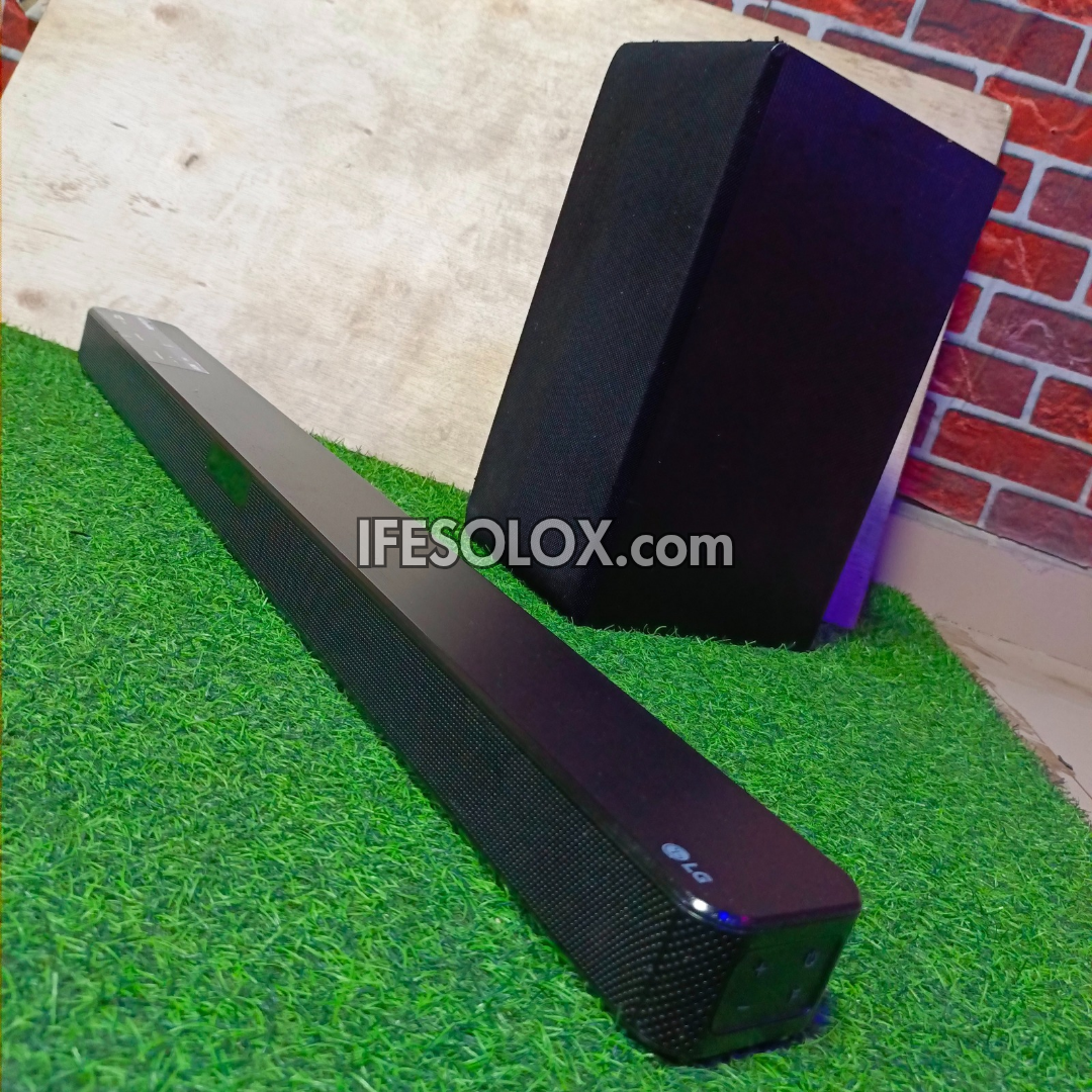 LG SN4 2.1Ch 300Watts High Resolution Bluetooth Sound Bar with Wireless Subwoofer (HDMI In/Out) - Foreign Used