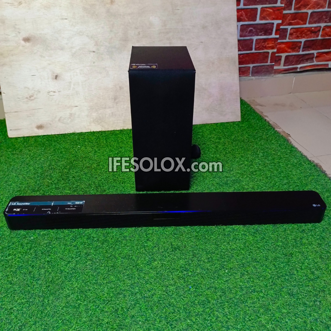 LG SN4 2.1Ch 300Watts High Resolution Bluetooth Sound Bar with Wireless Subwoofer (HDMI In/Out) - Foreign Used
