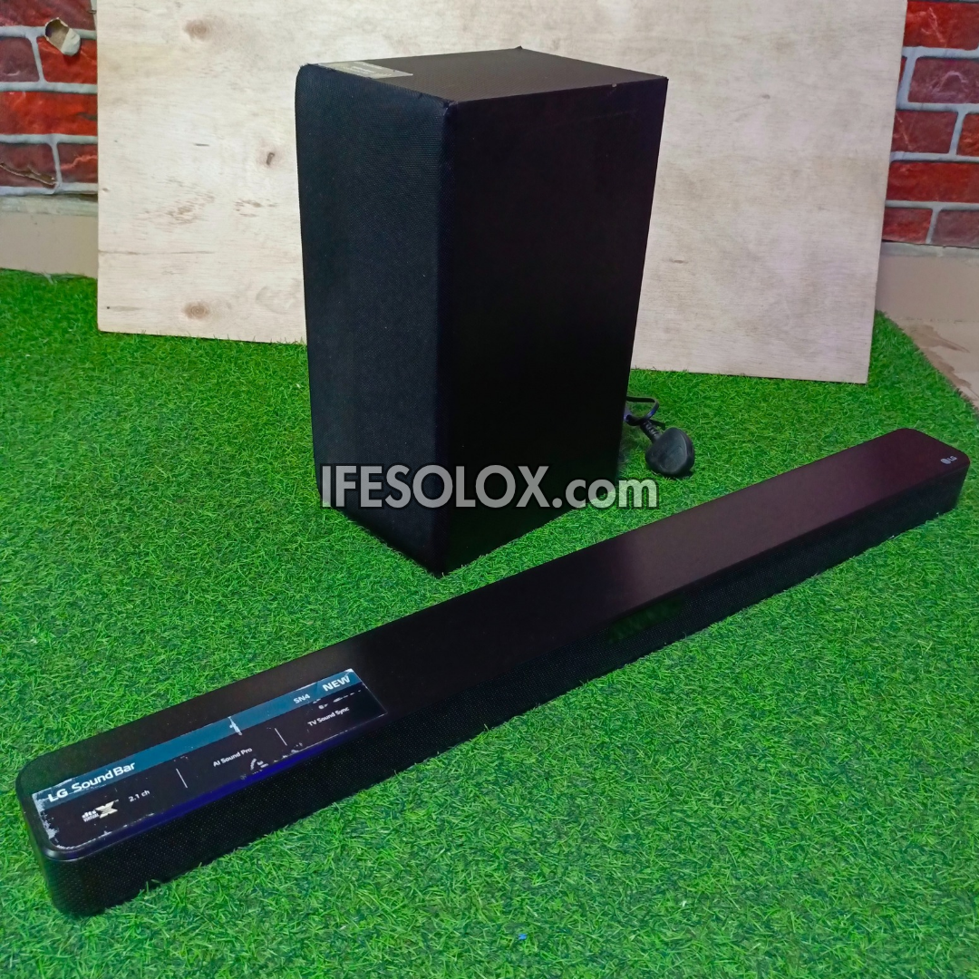 LG SN4 2.1Ch 300Watts High Resolution Bluetooth Sound Bar with Wireless Subwoofer (HDMI In/Out) - Foreign Used