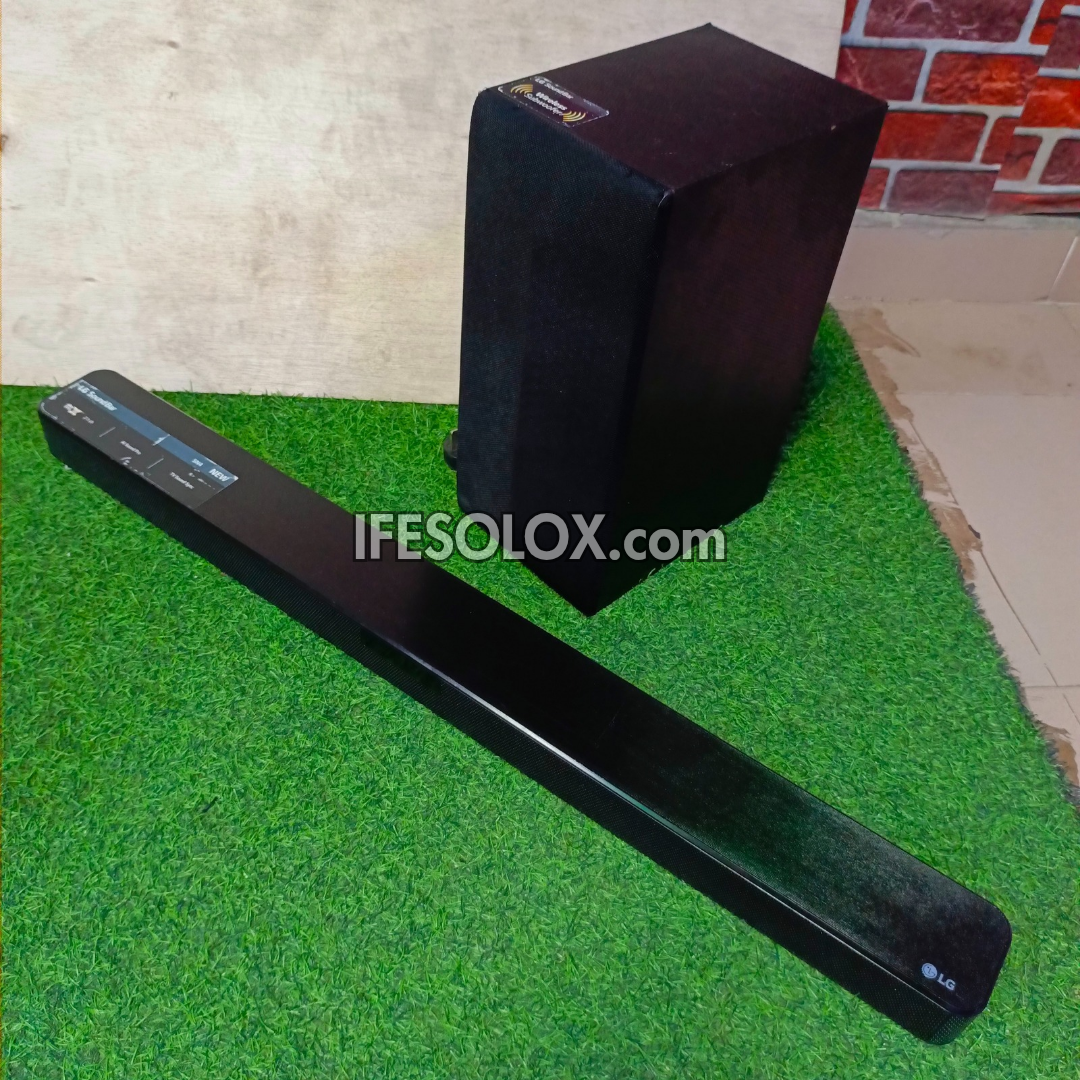 LG SN4 2.1Ch 300Watts High Resolution Bluetooth Sound Bar with Wireless Subwoofer (HDMI In/Out) - Foreign Used