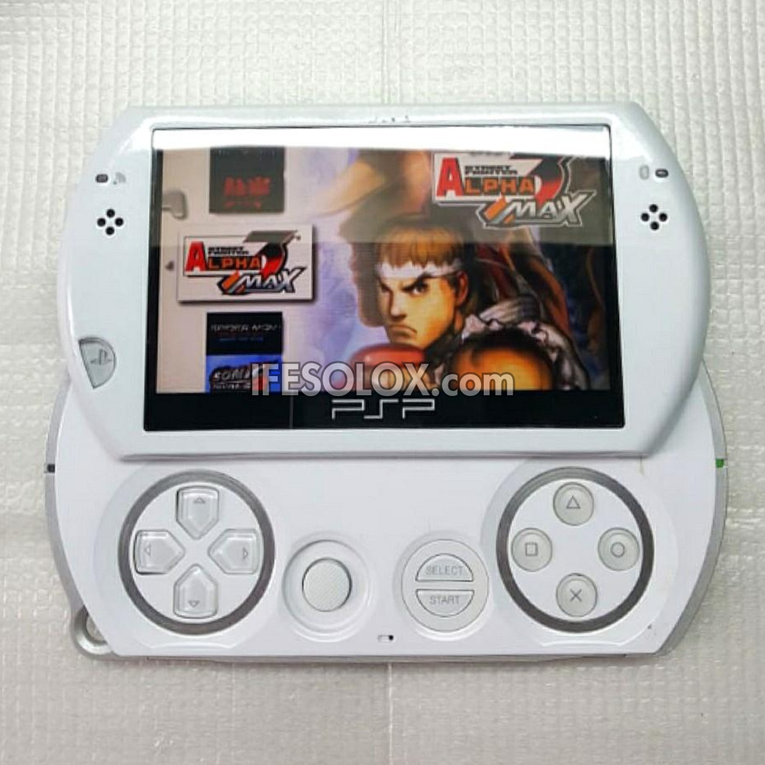 PlayStation Portable PSP Go N1000 series Game Console with 16GB Memory Stick and 20 Games (White) - Foreign Used