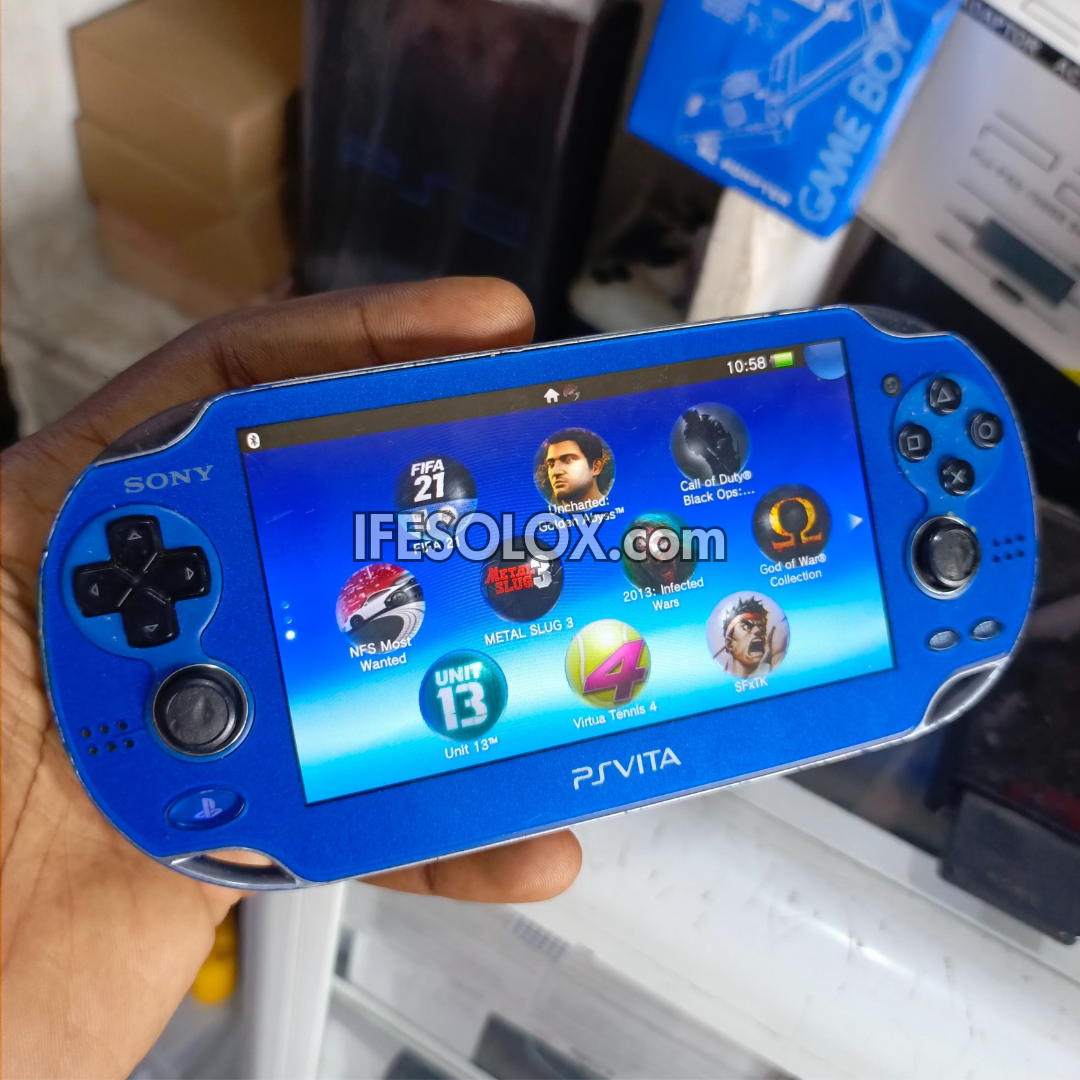 PlayStation VITA PCH-1000 Series Game Console + 32GB Memory Stick and 10 Games (Blue) - Foreign Used