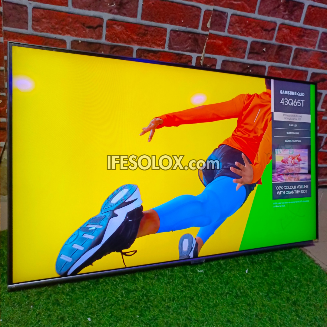Outdoor display screen with a person running, showing 'IFESOLOX.com' branding.