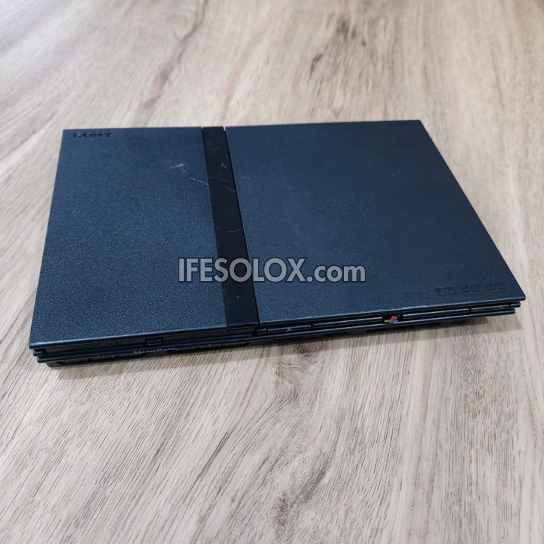 Sony Playstation 2 (PS2) Slim Game Console Complete Set with 2 DUALSHOCK Wired Controllers & 10 Titles - Foreign Used