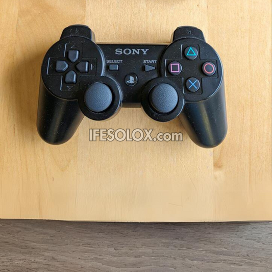 Console de jeu Sony Playstation 3 (PS3) Slim 120 Go avec 1 manette DUALSHOCK et 10 jeux - Occasion étrangère