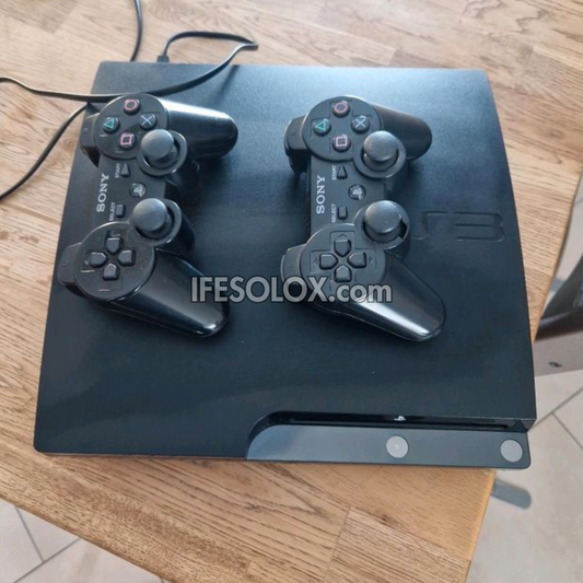Sony Playstation 3 (PS3) Slim 500GB Game Console Complete Set with 2 DUALSHOCK Controllers and 30 Titles - Foreign Used