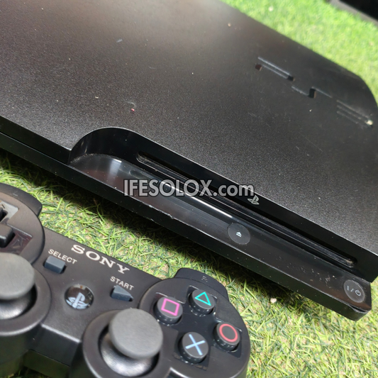 Console de jeu Sony Playstation 3 (PS3) Slim 120 Go avec 1 manette DUALSHOCK et 10 jeux - Occasion étrangère