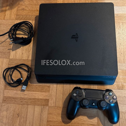Console de jeu Sony Playstation 4 (PS4) Slim 1 To avec 1 manette DUALSHOCK 4 et 10 jeux - Occasion étrangère
