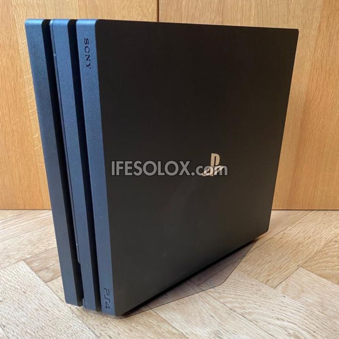 Sony Playstation 4 (PS4) Pro 1TB Game Console with 2 DUALSHOCK 3 Controllers with Charging Dock - Foreign Used