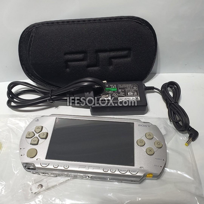 PlayStation Portable PSP 1000 series Game Console with 16GB Memory Stick and 15 Games (Silver) - Foreign Used