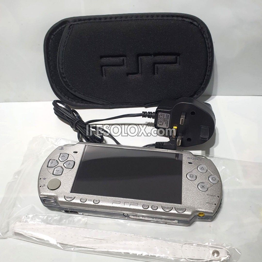 PlayStation Portable PSP 2000 series Slim Game Console with 16GB Memory Stick and 15 Games (Silver) - Foreign Used