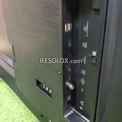 Close-up of the rear I/O panel of a Hisense QLED television, showing various ports including USB, HDMI, DisplayPort, VGA, and RF, with a watermark 'IFESOLOX.com' across the center.