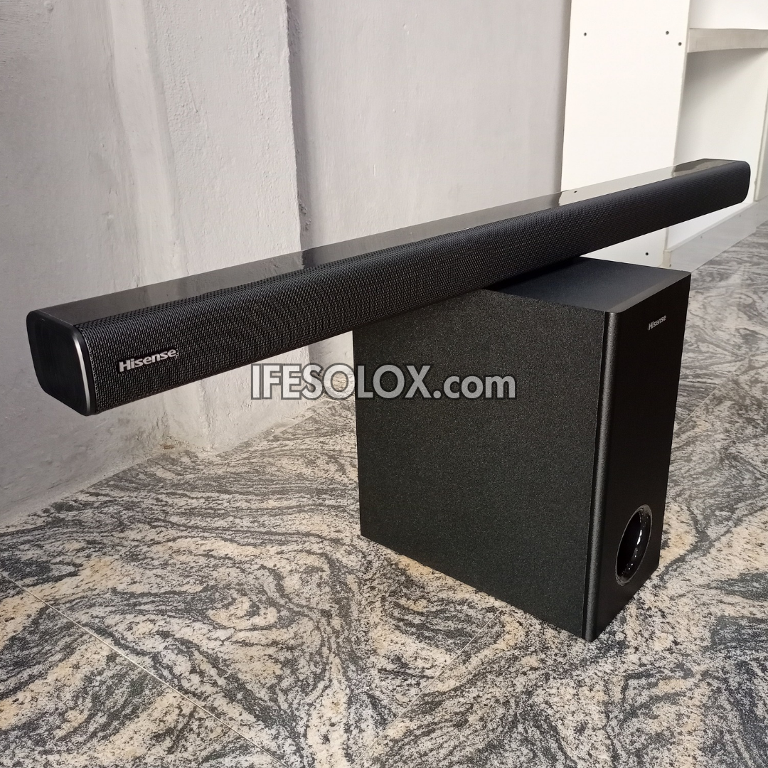 Hisense soundbar with subwoofer on a marble floor