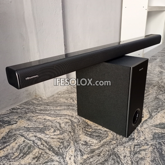 Hisense soundbar with subwoofer on a marble floor