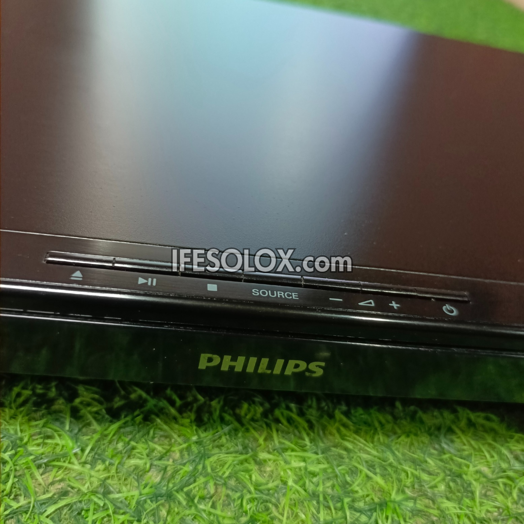 Philips DVD player on a grassy surface with 'IFESOLOX.com' branding.