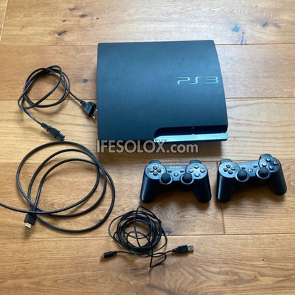 Sony Playstation 3 (PS3) Slim 500GB Game Console Complete Set with 2 DUALSHOCK Controllers and 30 Titles - Foreign Used