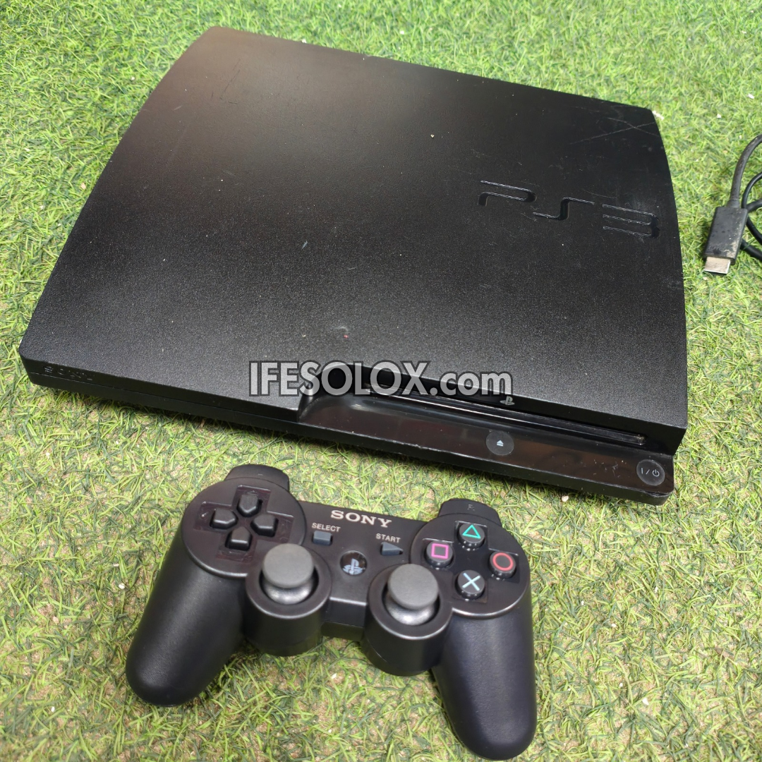 Console de jeu Sony Playstation 3 (PS3) Slim 120 Go avec 1 manette DUALSHOCK et 10 jeux - Occasion étrangère