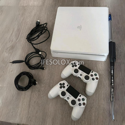 Sony Playstation 4 (PS4) Slim 1TB White Game Console with 2 DUALSHOCK 4 Controllers and 10 Titles - Foreign Used
