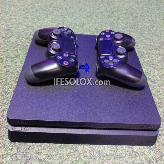 Sony Playstation 4 (PS4) Slim 1TB Game Console with 2 DUALSHOCK 4 Controllers and 20 Games - Foreign Used