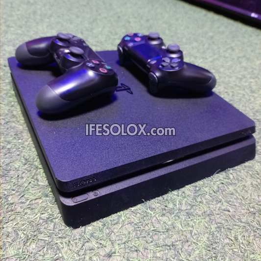 Sony Playstation 4 (PS4) Slim 1TB Game Console with 2 DUALSHOCK 4 Controllers and 20 Games - Foreign Used