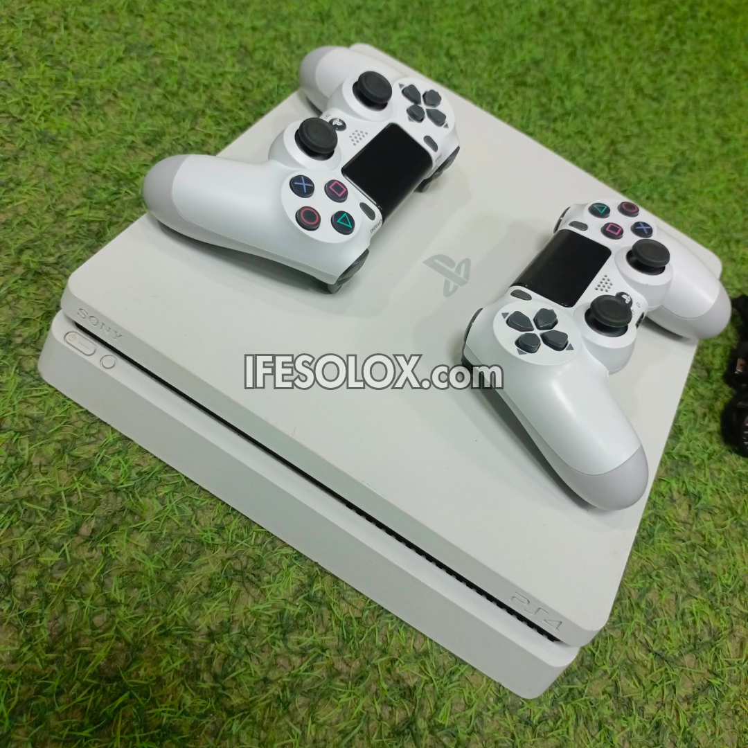 Sony Playstation 4 (PS4) Slim 500GB White Game Console with 2 DUALSHOCK 4 Controllers and 10 Games - Foreign Used