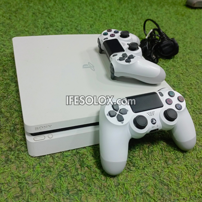 Sony Playstation 4 (PS4) Slim 500GB White Game Console with 2 DUALSHOCK 4 Controllers and 10 Games - Foreign Used