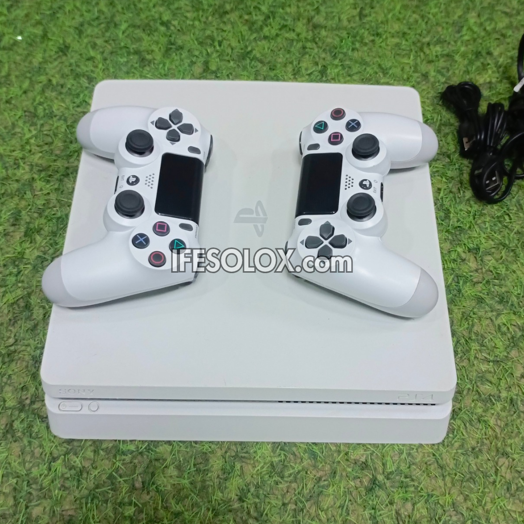 Sony Playstation 4 (PS4) Slim 500GB White Game Console with 2 DUALSHOCK 4 Controllers and 10 Games - Foreign Used
