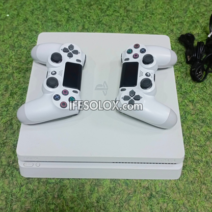 Sony Playstation 4 (PS4) Slim 500GB White Game Console with 2 DUALSHOCK 4 Controllers and 10 Games - Foreign Used